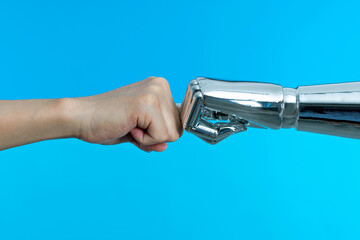 Robot and human hand making fist bump