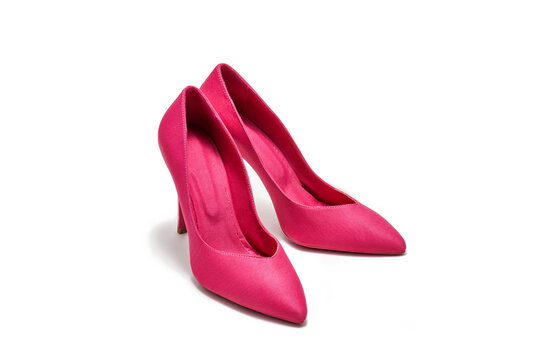 Pink high-heeled shoes on a white background