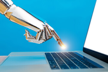 Robot hand pointing to laptop