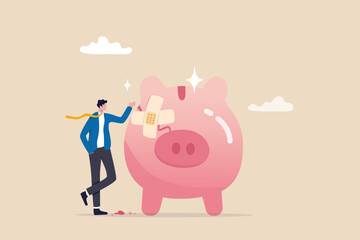 Fix financial problem, investment or saving impacted by crisis or inflation, bankruptcy, deposit or budget concept, poor cracked piggy bank with bandage metaphor of fixing problem.