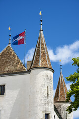 turret of castle of Nyon and flag of canton of Vaud in Switzerland © hectorchristiaen