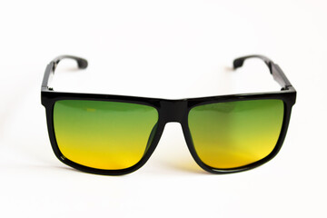 Glasses with green lens on white background