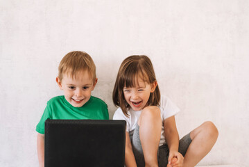 Smiling children learn online, play, have fun or chat with friends. Maybe they are looking for something interesting.