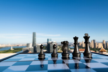 Chess pieces on city background