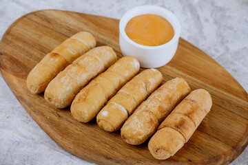 Fried tequeños, fingers stuffed with salty artisanal cheese, typical Venezuelan and Latin American food