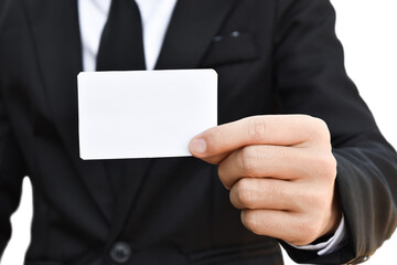 Businessman hand holding white business card isolated on transparent background - PNG format.