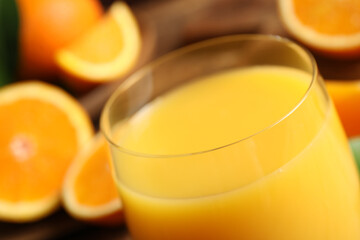 Glass of delicious fresh orange juice, closeup