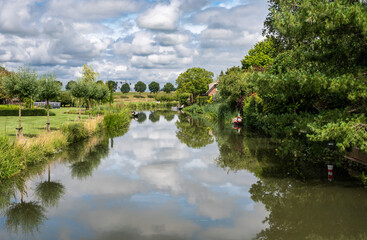 Fototapeta na wymiar Tiel, Gelderland, The Netherlands, Reflecting nature in the water of the River Ligne