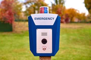 emergency box in city park - police call button for help from criminals. Park security, order in...
