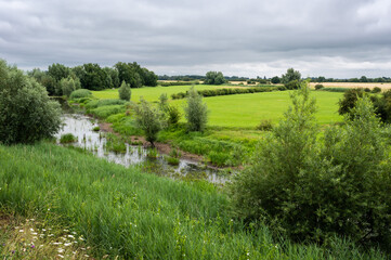 View over the natural floodplain with agriculture field and wetland around Ochten