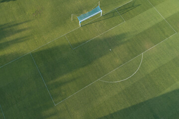 Aerial view of the centre of a grass soccer field. © VicVaz