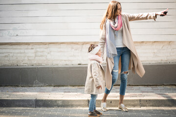 Mother with little daughter having fun together 