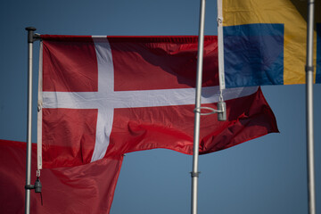 Denmark flag isolated on sky background. close up waving flag of Denmark. flag symbols of Denmark.