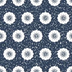 White flower on a dark background with scuffs and scratches, seamless pattern for textile