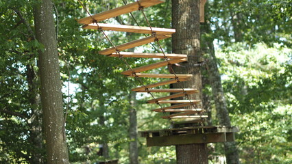 Accrobranche, adventure treetop park ropes and elements, for tree climbing sport and accrobranche