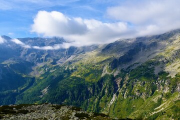 Alpine landscape in High Tauern mountains with the peak covered in clouds in Carinthia, Austria