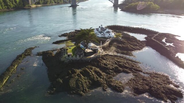 Whitebait island landmark on Welsh Swellies sunset river private secluded cottages aerial view orbiting right
