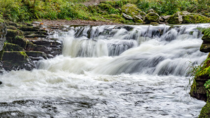 Fototapeta premium View of a small waterfall on the East Lyn River