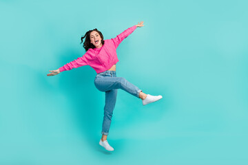 Full length photo of lovely woman wear pink jumper jeans sneakers flying open mouth having fun...