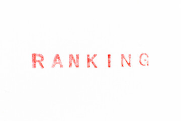 Red color ink rubber stamp in word ranking on white paper background