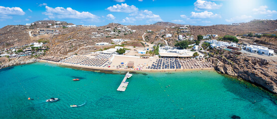 Panoramic aerial view of the popular Super Paradise Beach at Mykonos island, Cyclades, Greece, during summer time