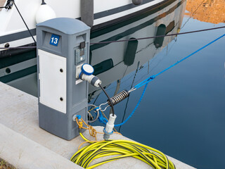 Charging station for boats, electrical outlets to charge ships in harbor. Electrical power sockets...