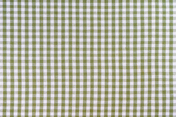 Green classic checkered tablecloth texture, background with copy space. Background texture checkered pattern fabric for cuisine, menu. Food mockup, template, restaurant wallpaper, kitchen backdrop