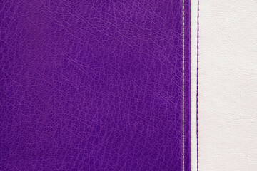 Fototapeta premium Natural, artificial purple and white leather texture background with vertical decorative seam. Material for sport items, clothes, furnitre and interior design. ecological friendly leatherette.