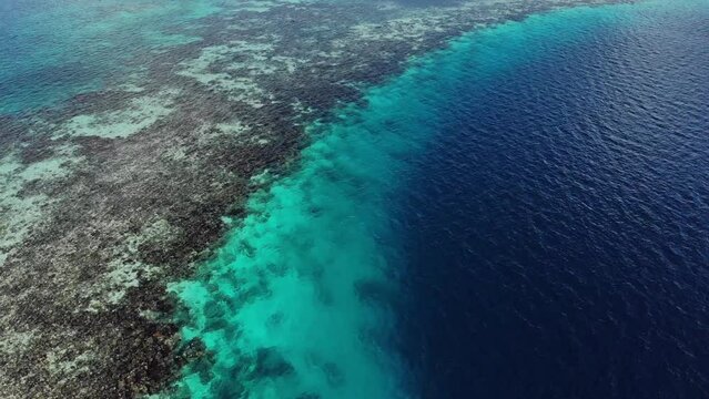 Aerial view drone shot of Great Blue Hole barrier riff, giant marine sinkhole High quality FullHD footage
