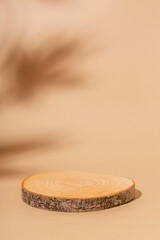 Minimal modern product vertical display on beige background. Wood slice podium. Concept scene stage showcase for new product, promotion sale, banner, presentation, cosmetic