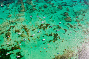 gorgeous Vacation destination - top view azure water with boats anchored in shallow water near...