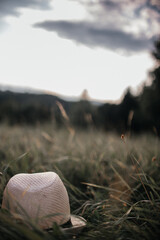 a light hat in the grass with a nice view on the mountains 