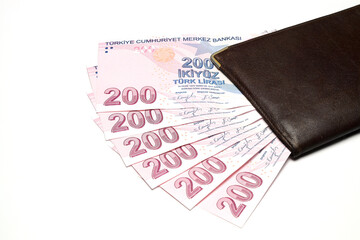 Turkish lira banknotes in a wallet isolated on white background. 
