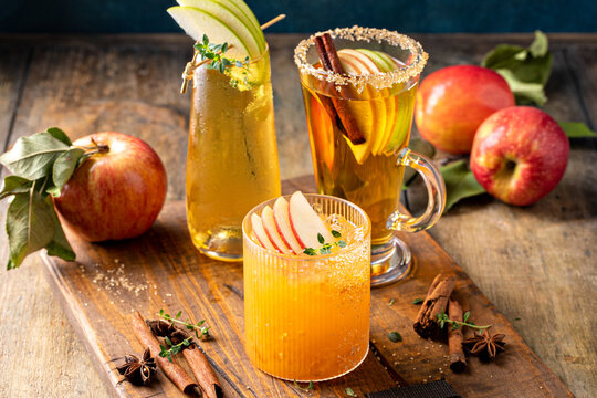 Variety of fall cocktails or mocktails made with apple cider