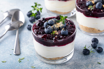 Blueberry cheesecake in a jar with graham cracker base