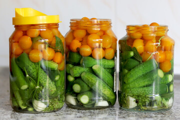 The process of preserving cucumbers and tomatoes for the winter. selective focus