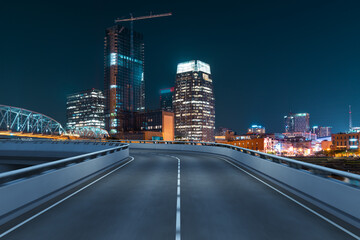 Plakat Empty urban asphalt road exterior with city buildings background. New modern highway concrete construction. Concept of way to success. Transportation logistic industry fast delivery. Nashville. USA.