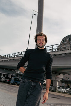A stylish portrait of a charismatic man in the city 