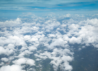 Beautiful clouds on the horizon blue sky photographed from a plane. - 524065554