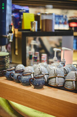 Pan-Asian cafe interior, bar counter with crockery