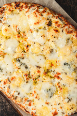 Roman-style pizzas with cheese. Roman square pizza or Pinsa on a thick dough, Italian Cuisine