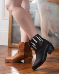woman's legs wearing leather fashion shoes of different casual and dress styles in assorted colors