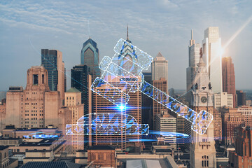 Aerial panoramic cityscape of Philadelphia financial downtown, Pennsylvania, USA. City Hall Clock Tower, sunrise. Hologram of legal icons. The concept of law, order, regulations and digital justice.