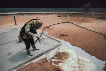Male worker surface corrosion plate preparation by sandblasting bounce off of tank top deck.