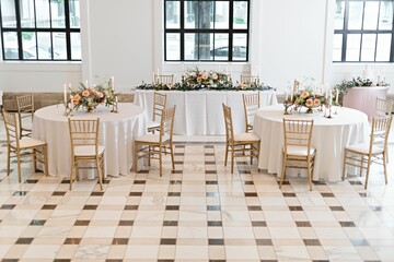 Reception with round tables decorated in a wedding style