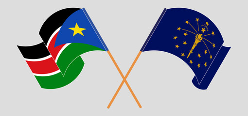 Crossed and waving flags of South Sudan and the State of Indiana