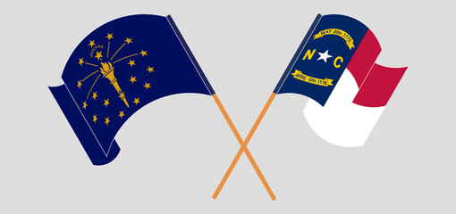 Crossed and waving flags of the State of Indiana and The State of North Carolina