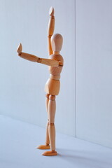 Concept of making the stop signal with the figure of a wooden boy