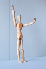 Concept of making the stop signal with the figure of a wooden boy