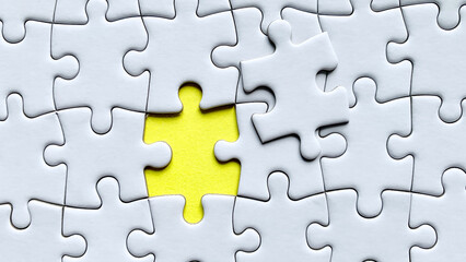 Jigsaw puzzle on yellow background with customizable space for text or ideas. Copy space